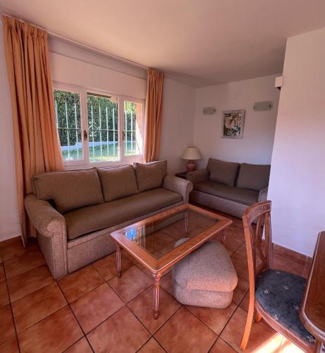 a living room with a couch and a coffee table at Marbella Villas in Marbella