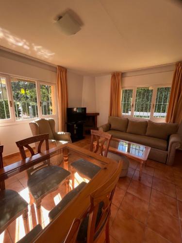 a living room with a couch and a table at Marbella Villas in Marbella
