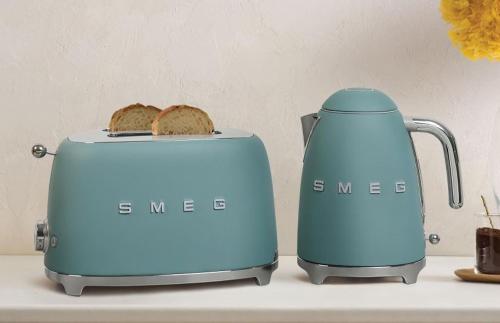two toasters sitting on a counter with bread at Pacific Sun Bargara in Bargara