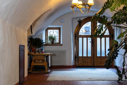 an archway leading to a door in a house at Gästehaus Goldener Stern in Lienz