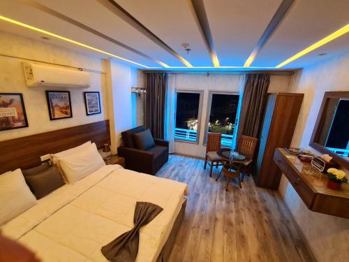 a hotel room with a large bed and a desk at tourist hotel cairo downtown in Cairo
