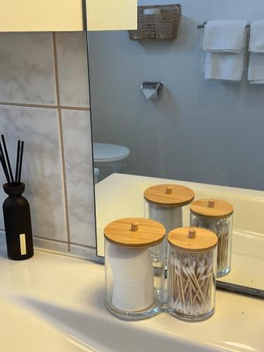 a bathroom counter with three stools and a toilet at Nice and comfortable apartment in Asker