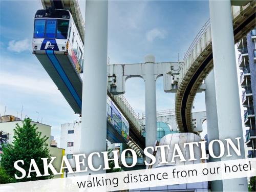 a train on a bridge with the words vacation station walking distance from our hotel at Hotel Century in Chiba