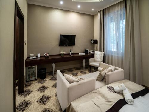 Arcanum Hotelにあるテレビまたはエンターテインメントセンター
