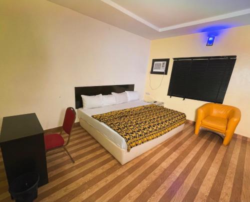 Postel nebo postele na pokoji v ubytování Okeyl Suites