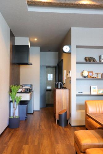 a room with a kitchen and a living room at Js STAY OTARU II in Otaru