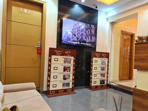a room with a tv and a waiting room at tourist hotel cairo downtown in Cairo