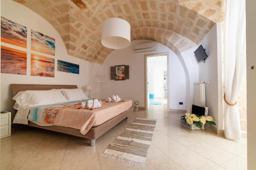 Posteľ alebo postele v izbe v ubytovaní Gioia Casa Vacanze by MONHOLIDAY