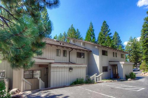 a large white building with a parking lot at Eagle's Lake Retreat condo in Incline Village