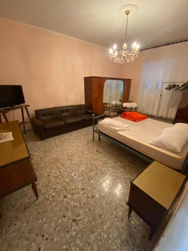 a living room with two beds and a couch at Antica dimora Cauto in Pietramelara