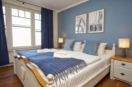 Postel nebo postele na pokoji v ubytování Ferienwohnung mit traumhaftem Meerblick - Haus am Meer FeWo 07