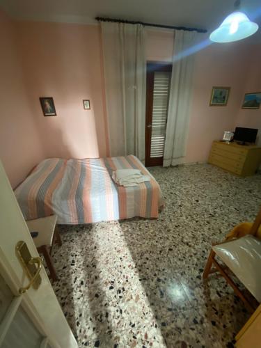 a bedroom with a bed in a room at Antica dimora Cauto in Pietramelara