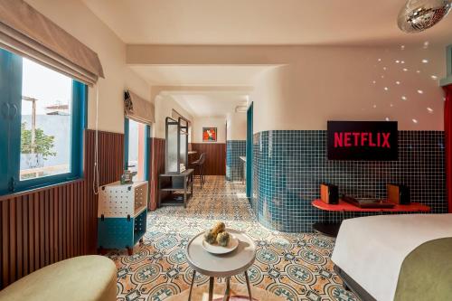a hotel room with a bed and a bathroom at Dakao Vibe Studios by CIRCADIAN in Ho Chi Minh City
