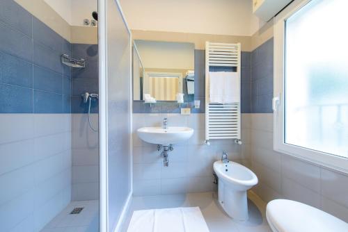 Koupelna v ubytování Hotel Falco