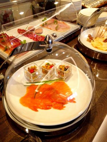 a buffet with several plates of food on a table at MeerBlickD21 in Norderney