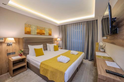 Postel nebo postele na pokoji v ubytování Royal Termal Hotel