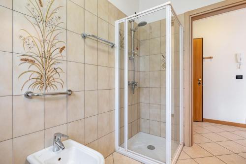 a bathroom with a shower and a sink at Agritur Laura in Nago-Torbole