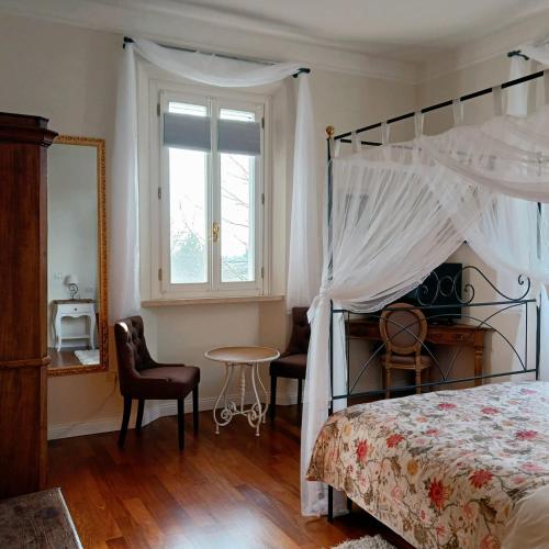 Ένα ή περισσότερα κρεβάτια σε δωμάτιο στο Tuscany Garden Inn