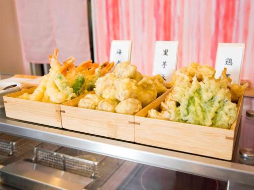 two baskets of food on a buffet table at Richmond Hotel Yamagata Ekimae in Yamagata