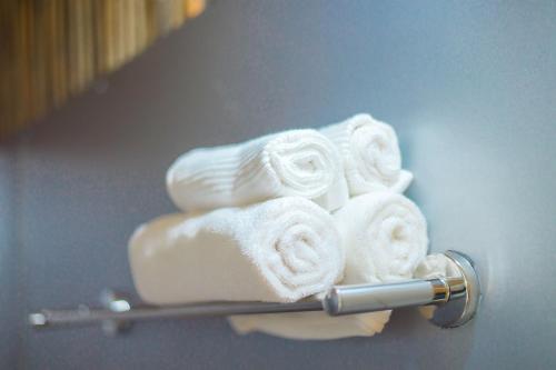 a pile of towels on a towel rack at HDT Farm Stay Thanh Chuong in Thái Nhã