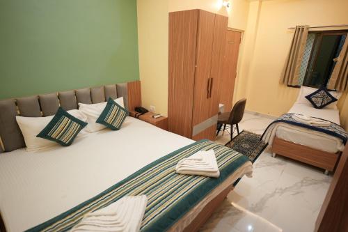 En eller flere senge i et værelse på Heaven Heritage