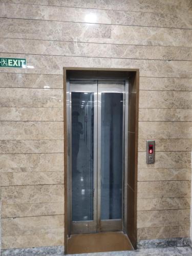 a building with a door on the side of it at Golden GSC Hotel in Amritsar