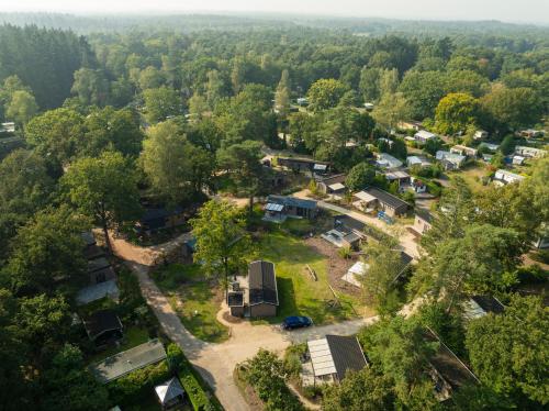 an aerial view of a small village in the forest at Veluwepark de Bosgraaf in Apeldoorn