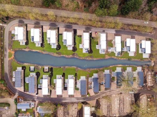an aerial view of a project with buildings and a river at Veluwepark de Bosgraaf in Apeldoorn