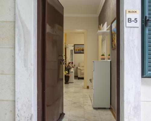 a hallway with a door leading to a living room at Montesan Luxury Apartments Sveti Stefan in Sveti Stefan