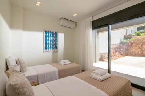 Ένα ή περισσότερα κρεβάτια σε δωμάτιο στο Altius Blue Apartments