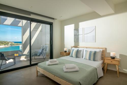 Ένα ή περισσότερα κρεβάτια σε δωμάτιο στο Altius Blue Apartments
