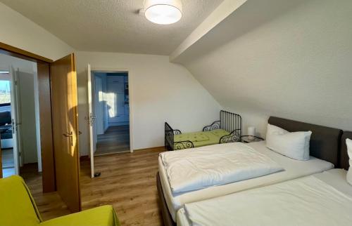 En eller flere senge i et værelse på Ferienwohnung Linder Grube