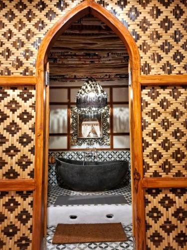 a bathroom with a bath tub in a room at Villa Tua, Beach Pool & Spa in Letman