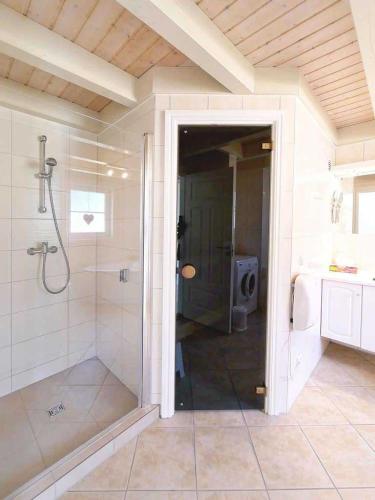 a bathroom with a shower and a walk in shower at Ferienpark Bad Saarow in Bad Saarow