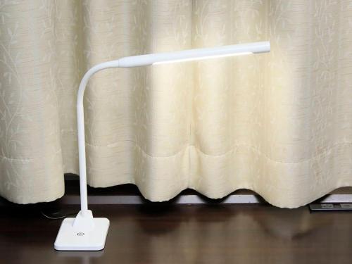 a white lamp sitting in front of a curtain at Richmond Hotel Yamagata Ekimae in Yamagata