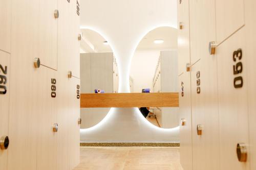 a row of lockers in a room with a mirror at INFINITY PLAZA BLOCK 1 in Atyraū