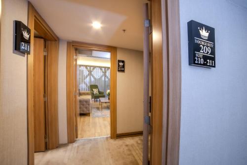 a hallway with a sign on the wall of a building at Royal Termal Hotel in Bursa