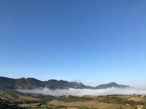 a misty valley with mountains in the background at Saint Sauveur havre de paix in Saint-Sauveur-Governet