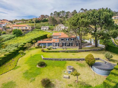 an aerial view of a house with a large yard at Quinta da Fonte in Prazeres