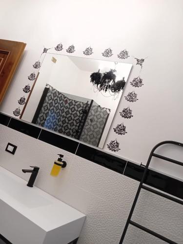 a bathroom with a sink and a mirror at La Sosta in Lunigiana in Monti di Licciana Nardi