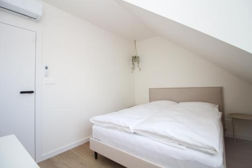 Postel nebo postele na pokoji v ubytování Rodinný apartmán se zahradou TRE Mikulov