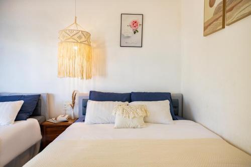 a bedroom with a bed and a clock on the wall at Boho Boutique Da Lat - View nhà lồng lãng mạn in Da Thanh