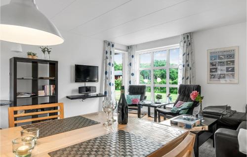 a living room with a couch and a table at One-Bedroom Holiday Home In Ribe in Mandø By