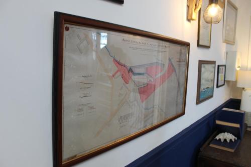 a large picture hanging on a wall at The Old Buoy Inn in Seahouses