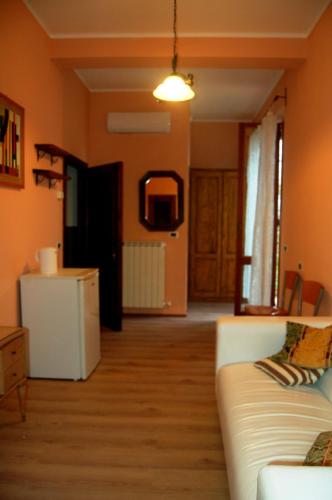 a living room with a couch and a table at Borgo Nuovo San Martino in Ambra