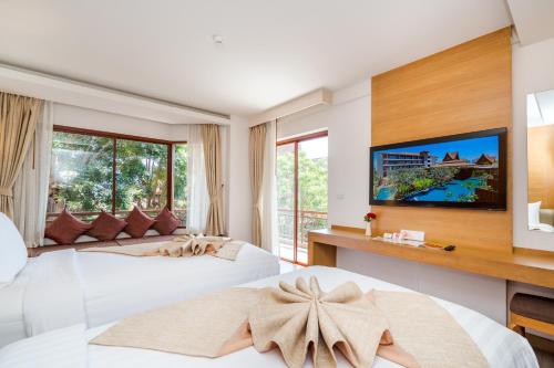 Postel nebo postele na pokoji v ubytování Ayrest Hua Hin Hotel