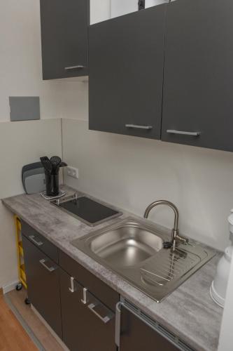 a kitchen with a sink and a counter top at Treibholz in Norderney