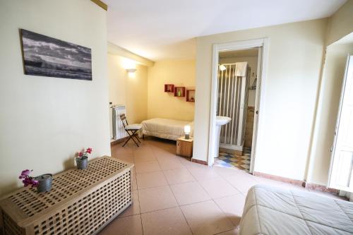 a hotel room with a bed and a bathroom at Antica Dimora in Palermo