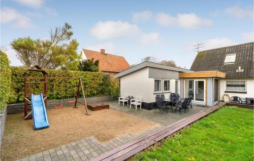 a backyard with a playground and a swing at Holiday Home Nykobing I in Ejerslev