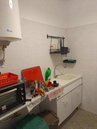 a kitchen with a sink and a microwave at A Casa di Lory in Atessa